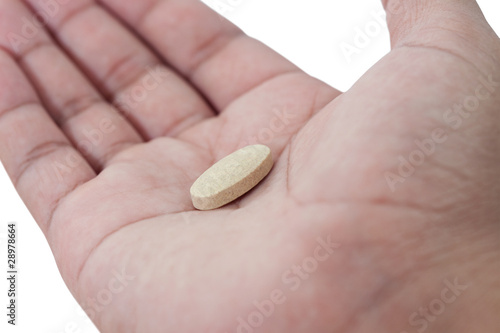Pill in a hand