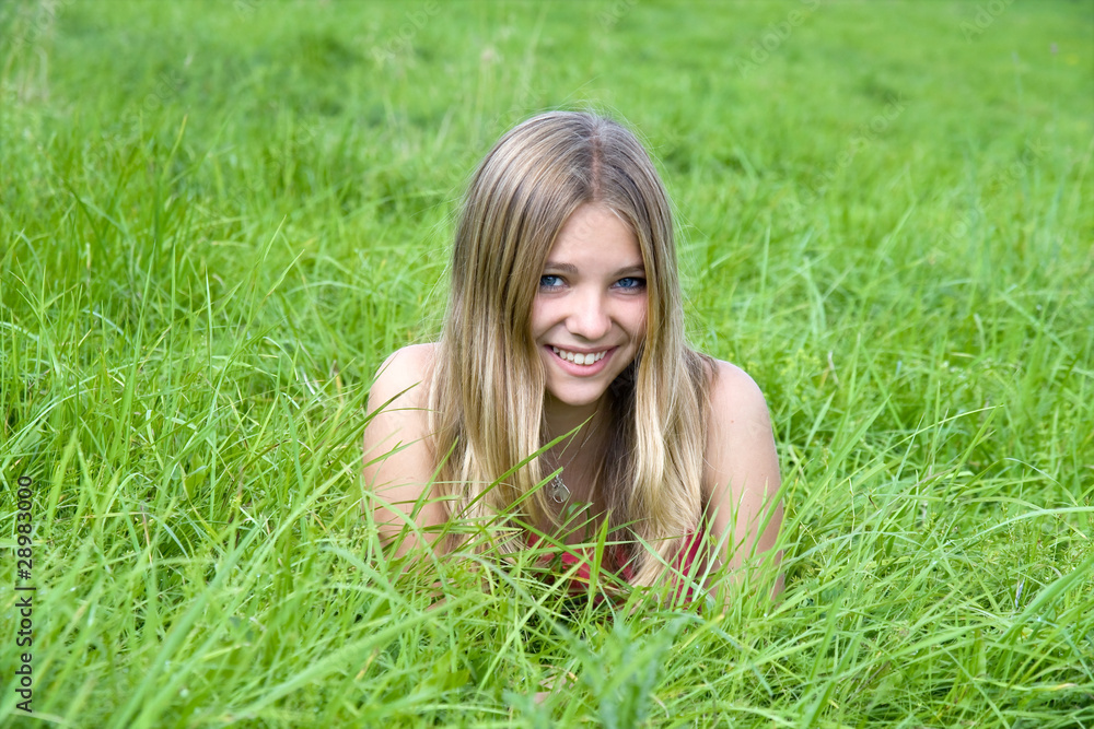 beautiful girl lying on grass field .. beautiful girl lying on grass field ..