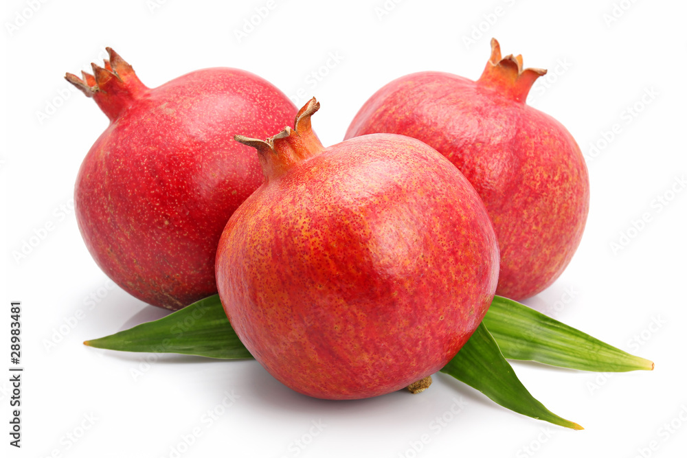 Pomegranate fruits with green leaf isolated Pomegranate fruits with green leaf isolated