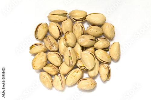 closeup image of pistachios on white background