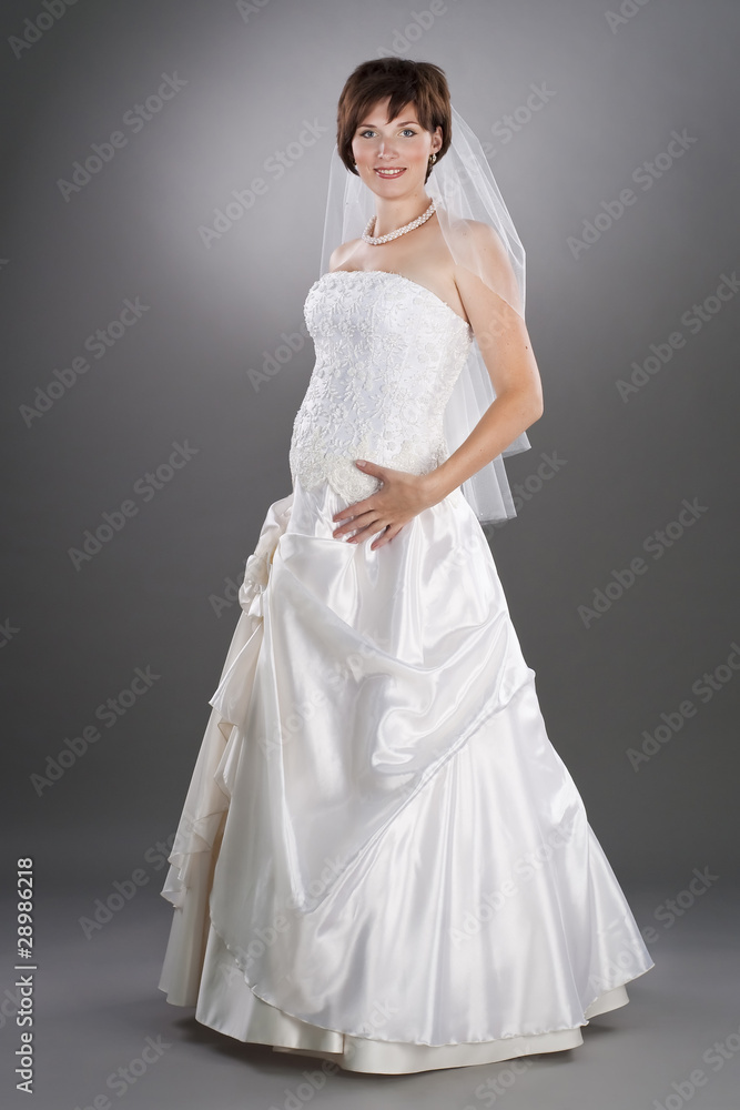 pretty pregnant bride wearing wedding gown