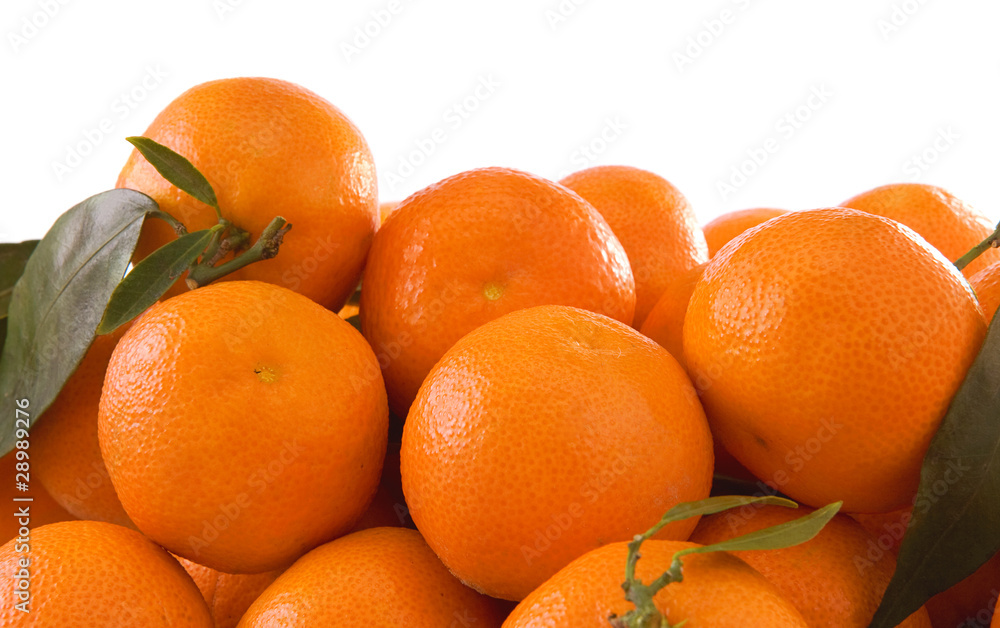 oranges and green leaves isolated on white oranges and green leaves isolated on white