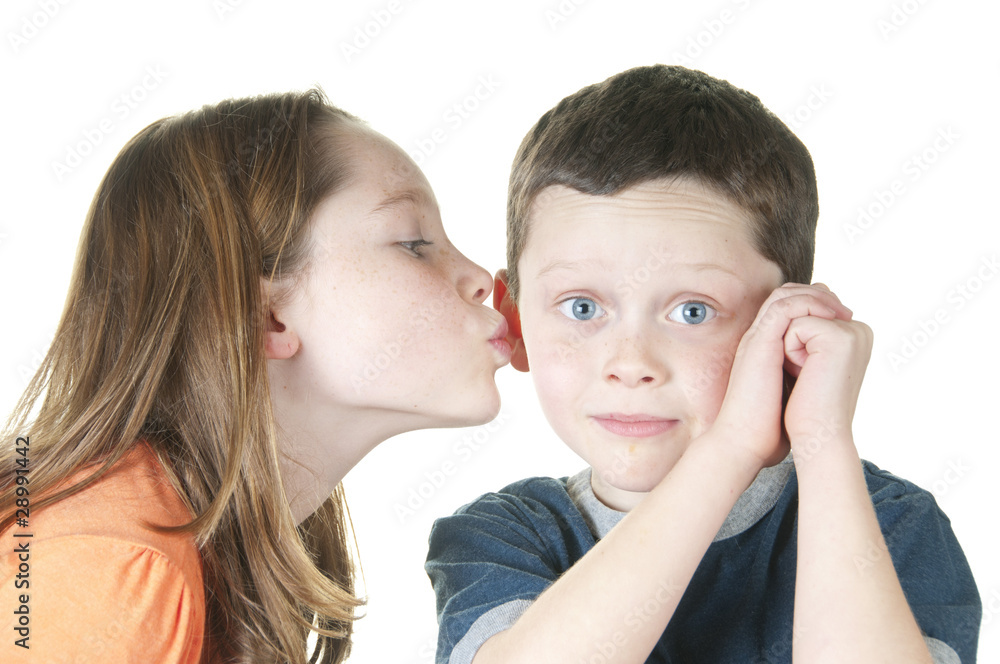 Young girl kissing boy on cheek Young girl kissing boy on cheek