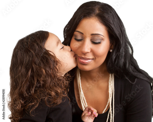 Young girl kisses her mother