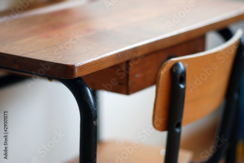 Empty school table with wooden chair photo