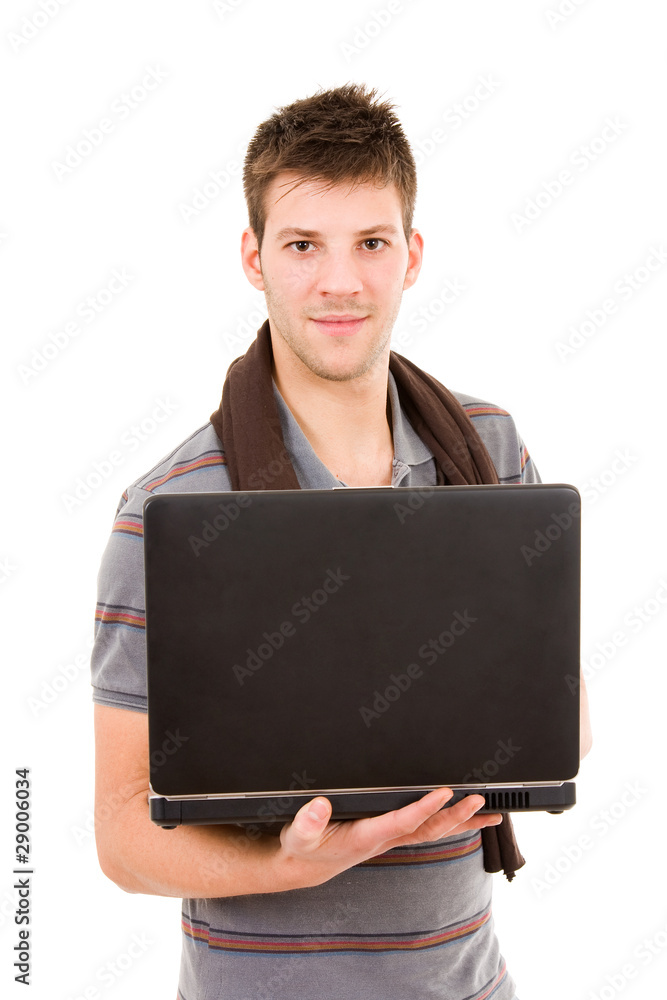 Young casual man standing with a laptop computer. Isolated on wh Young casual man standing with a laptop computer. Isolated on wh