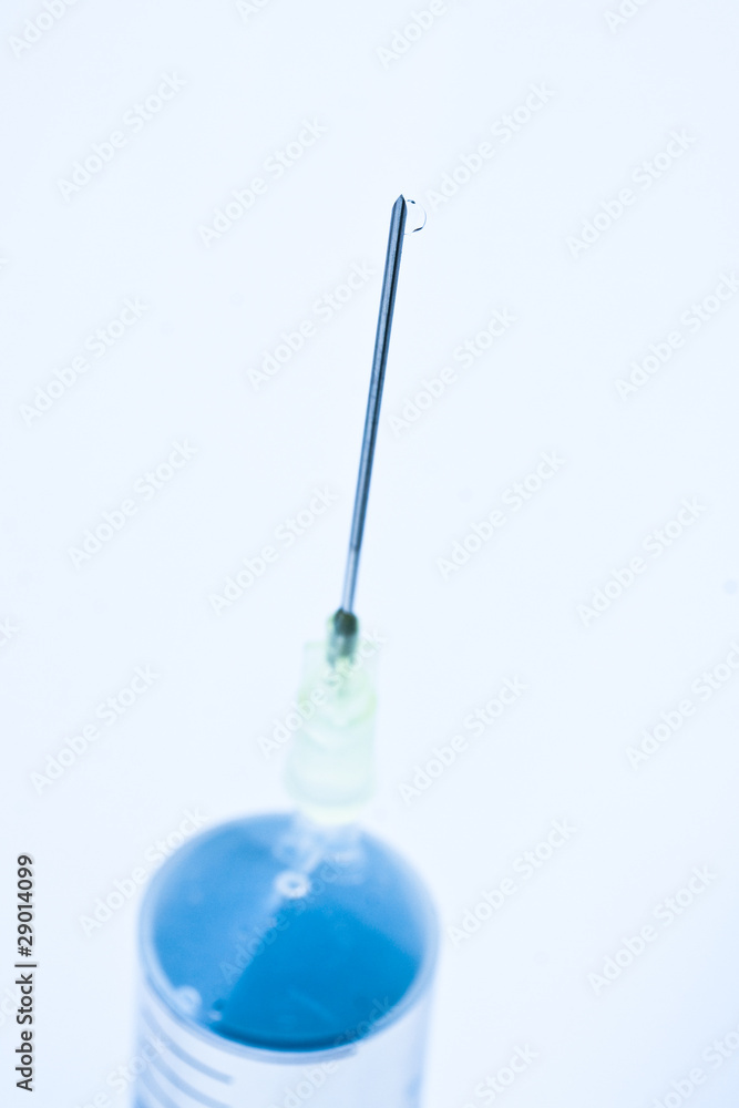 Needle with syringe, focus on tip Needle with syringe, focus on tip