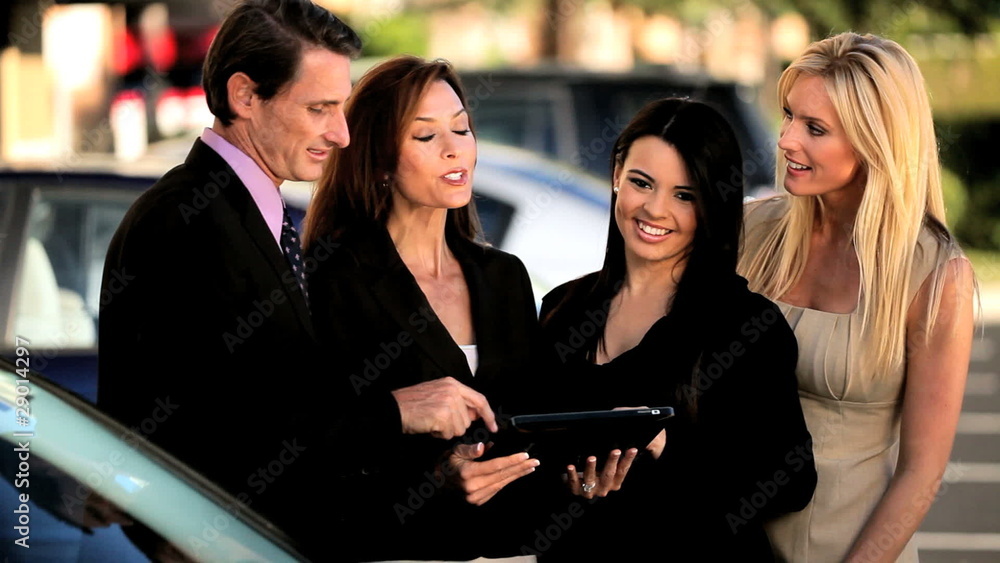 Team of Successful Business People with Wireless Tablet Team of Successful Business People with Wireless Tablet