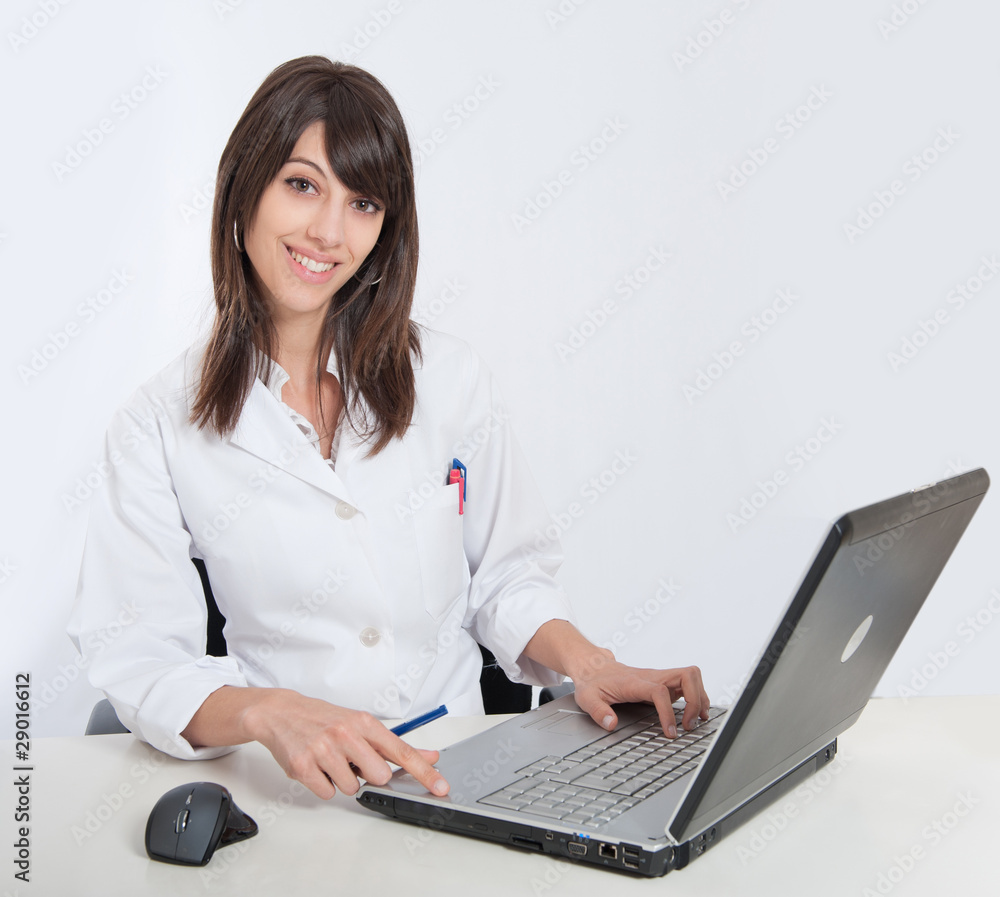 Smiling Nurse at her desk Smiling Nurse at her desk
