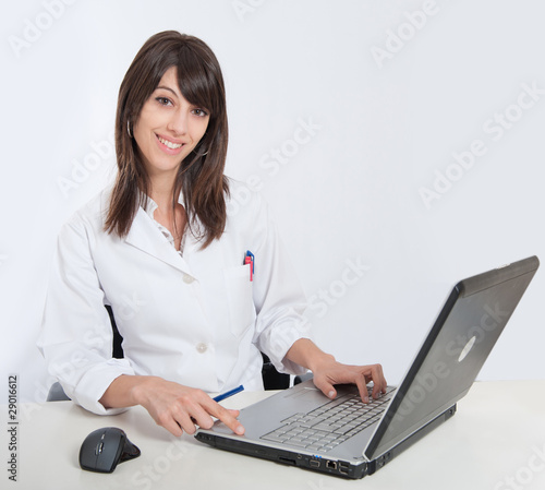 Smiling Nurse at her desk