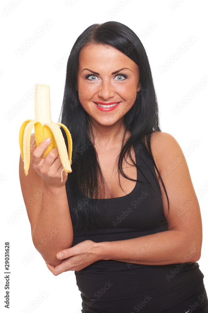Fitness girl with banana isolated on white Fitness girl with banana isolated on white