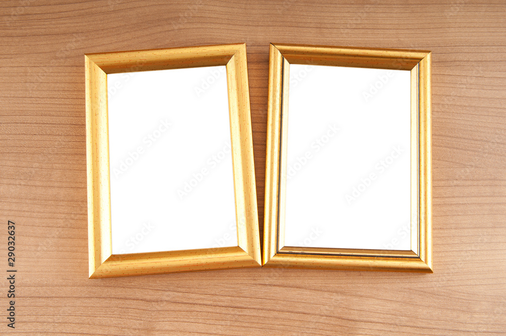 Picture frames on the polished wooden background Picture frames on the polished wooden background
