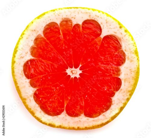 Close up of sliced pink grapefruit isolated on white