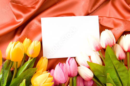 Fototapeta Naklejka Na Ścianę i Meble -  Envelope and flowers on the satin background