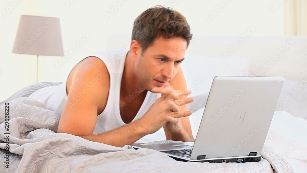 Angry man working on his laptop Angry man working on his laptop