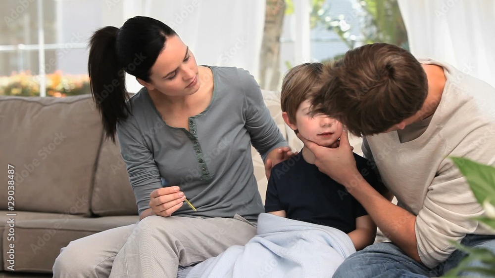 Couple taking care of their sick son Couple taking care of their sick son