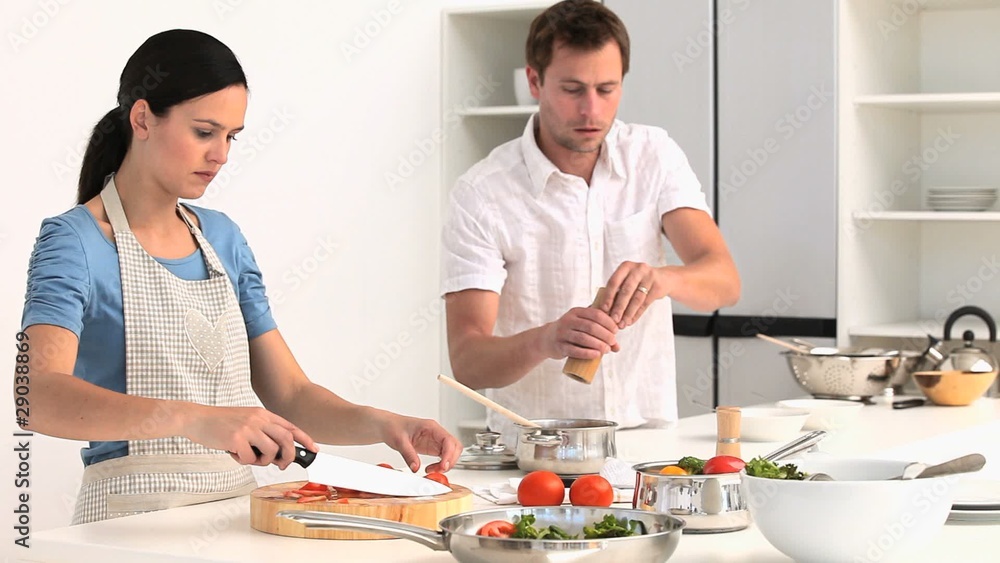 Young couple cooking together