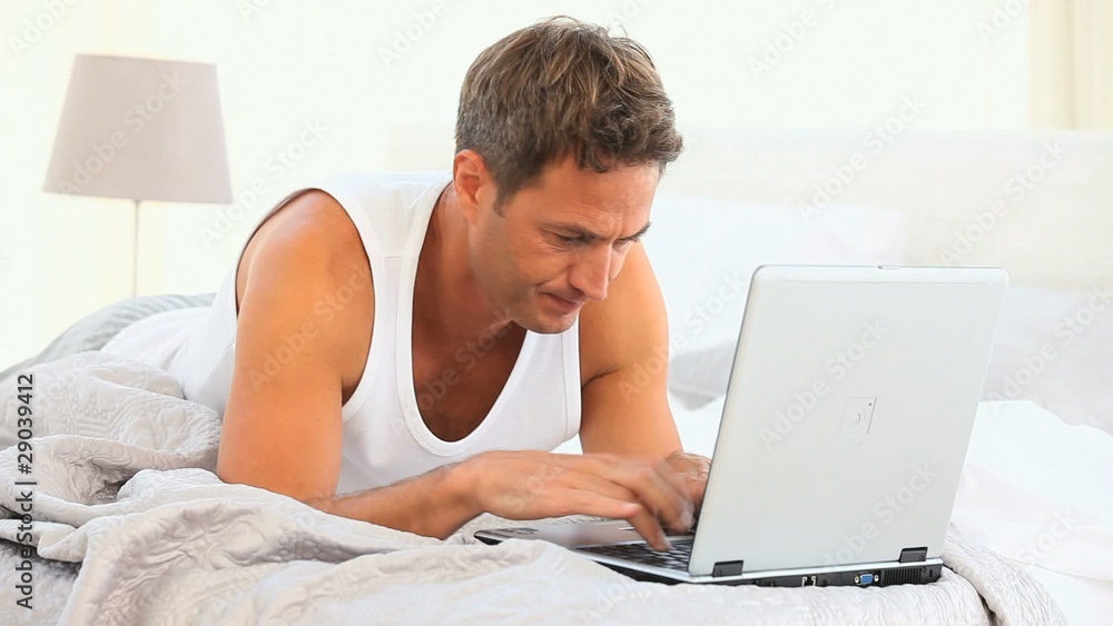 Anxious handsome man working on his laptop Anxious handsome man working on his laptop