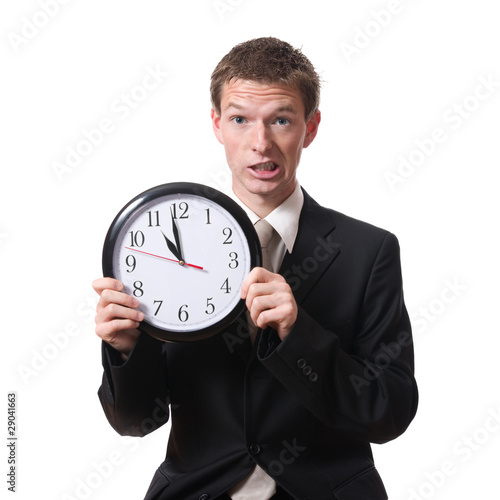 stressed businessman holding clock isolated on white