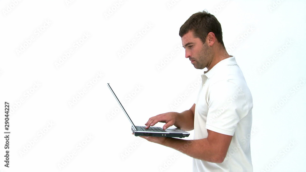 Smiling man using a laptop Smiling man using a laptop