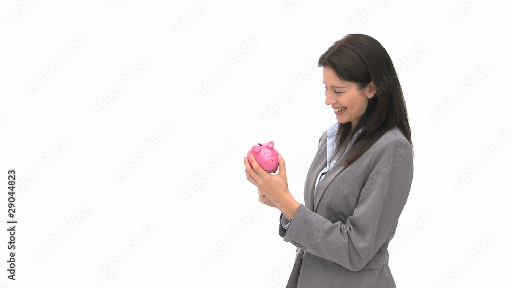 Businesswoman holding a piggy bank Businesswoman holding a piggy bank