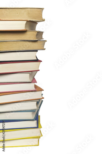 Stack of multicolored books isolated on white background