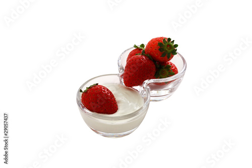 Strawberries with cream in double glass bowl isolated on white