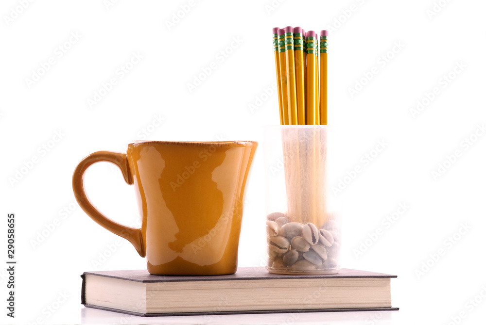 Coffee Mug with Pencils in Cup on Top of Book Coffee Mug with Pencils in Cup on Top of Book
