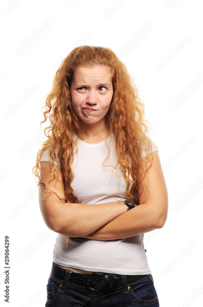 Young cute ginger standing with hands crossed and thinking Young cute ginger standing with hands crossed and thinking