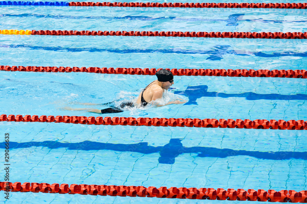 swimmer swimming in a pool