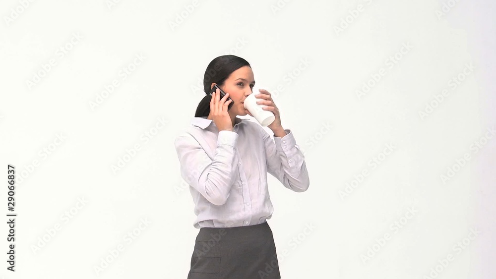 Businesswoman talking on the phone during a coffee break Businesswoman talking on the phone during a coffee break