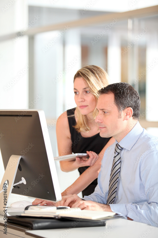 Office workers in front of computer Office workers in front of computer