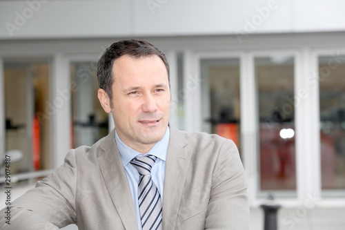 Businessman standing outside the office