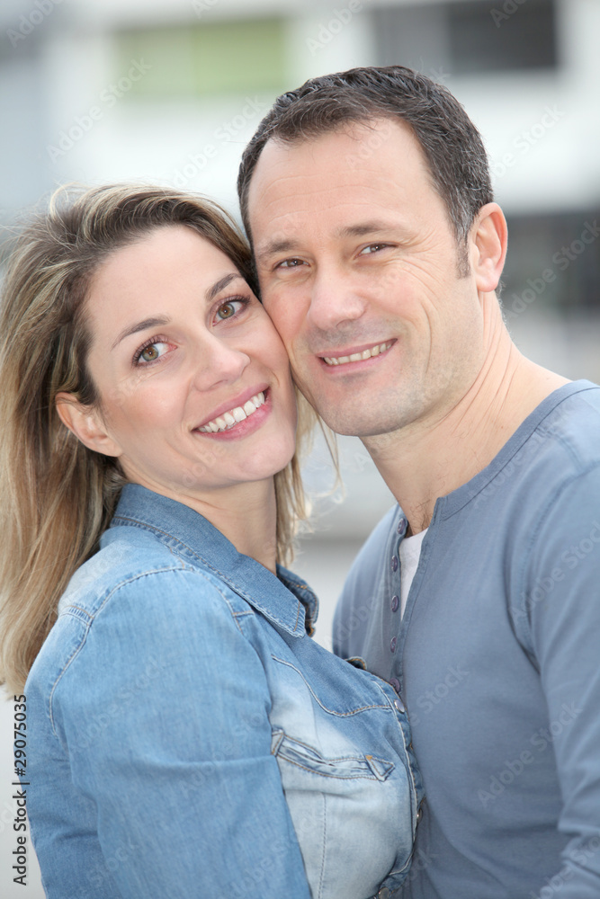 Portrait of happy couple standing outdoors Portrait of happy couple standing outdoors
