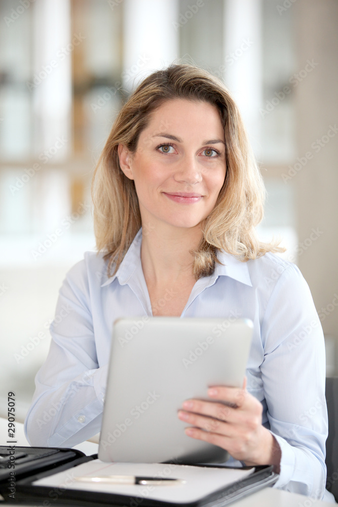 Office worker using electronic tab Office worker using electronic tab