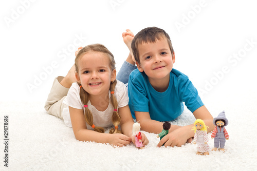 Happy kids boy and girl playing on the floor