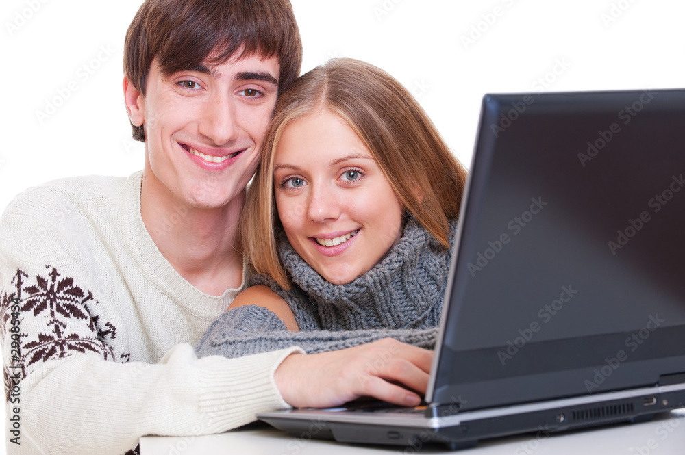 smiley couple with laptop