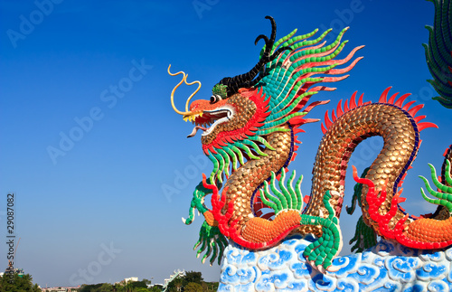 Dragon statue and natural blue sky  background © Sura Nualpradid