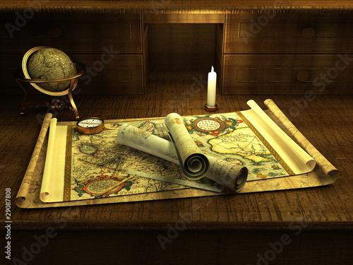 Vintage globe and compass on antique map