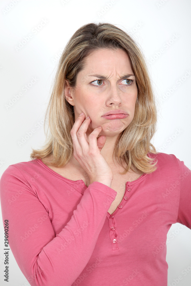 Portrait of blond woman with bored expression Portrait of blond woman with bored expression