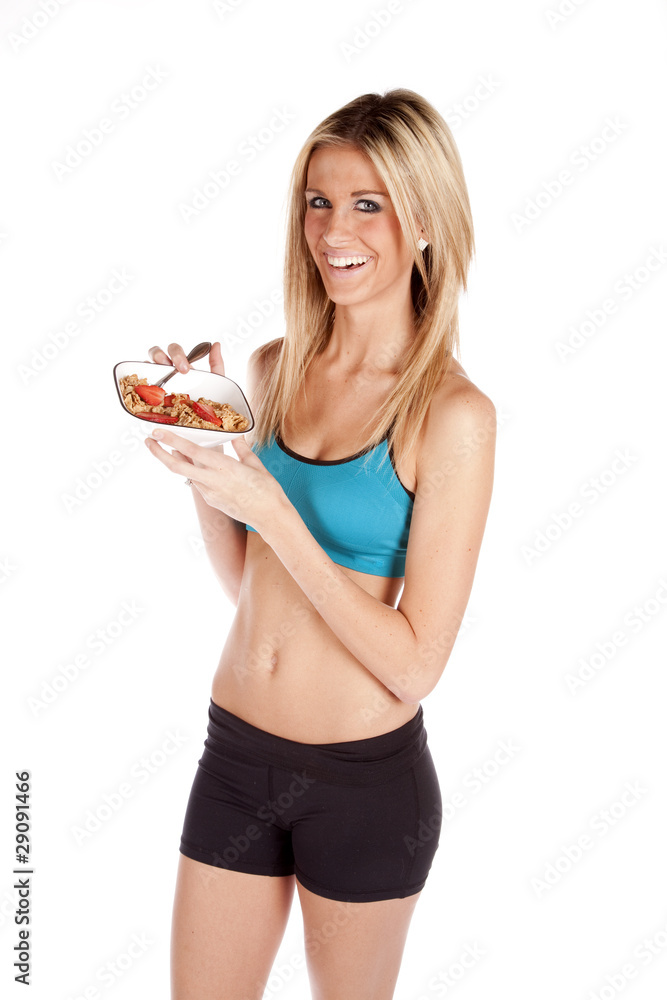 Woman standing with cereal bowl Woman standing with cereal bowl