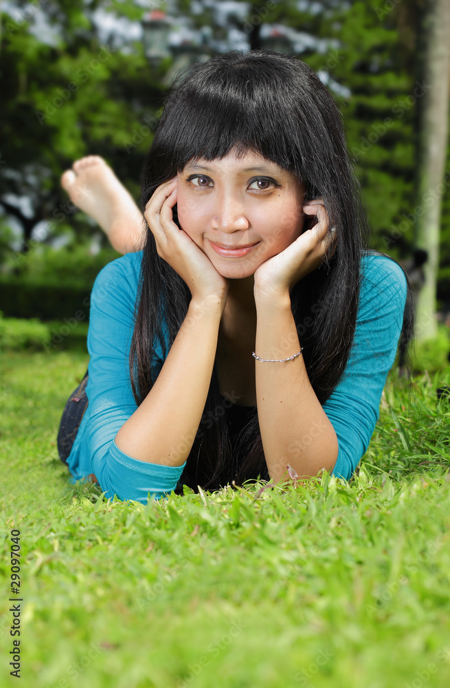 young asian beautiful girl relaxing on grass outdoor young asian beautiful girl relaxing on grass outdoor
