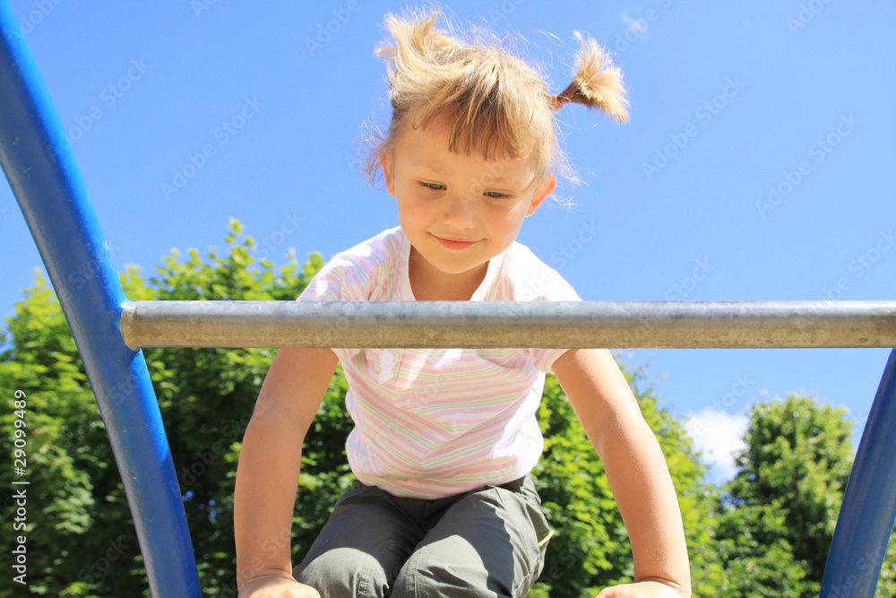 A child enters the ladder on the playground