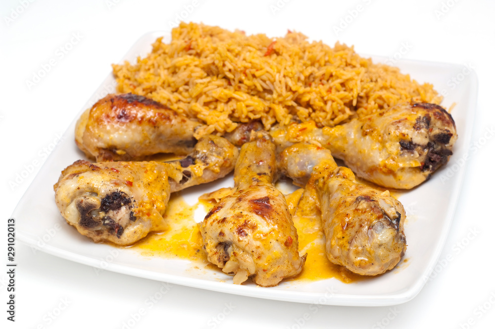 chicken drumbsticks and mexican rice on white chicken drumbsticks and mexican rice on white