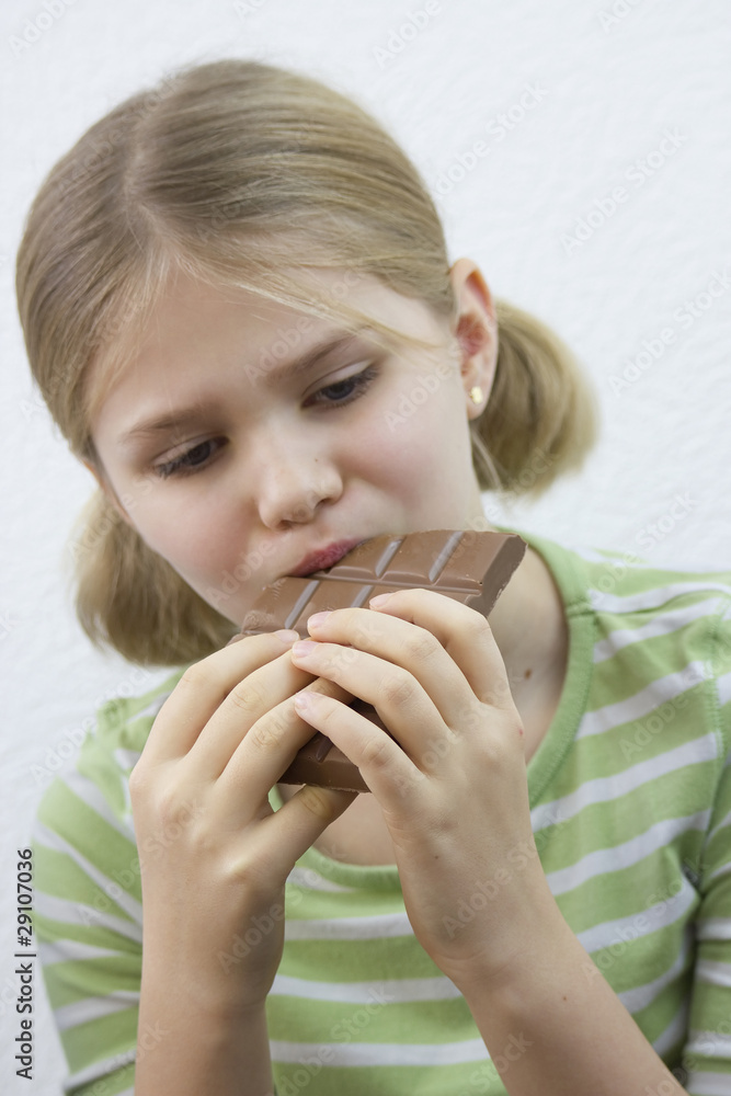 little pretty girl eating big chocolate bar little pretty girl eating big chocolate bar