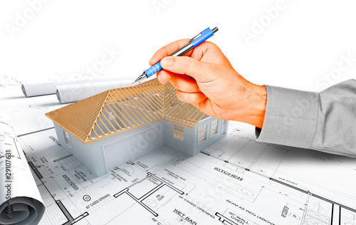 hand pointing on a house model