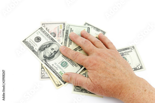 Hand on dollars