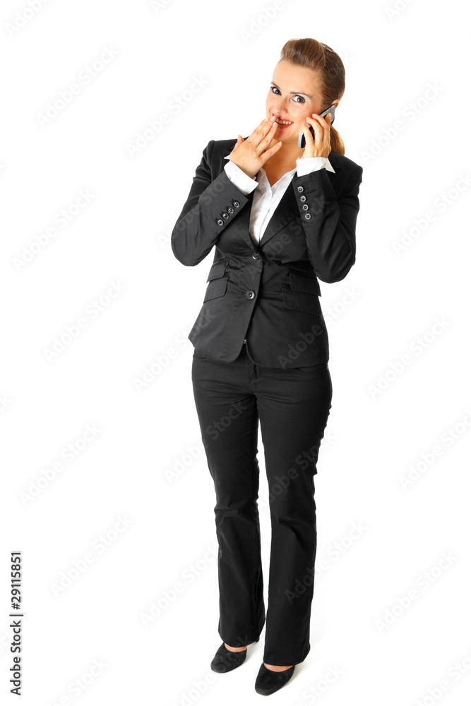 Confused modern business woman talking on mobile phone Confused modern business woman talking on mobile phone