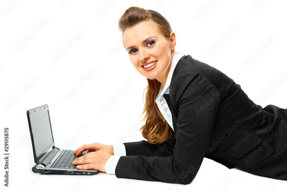 Laying on floor smiling modern business woman using laptop Laying on floor smiling modern business woman using laptop