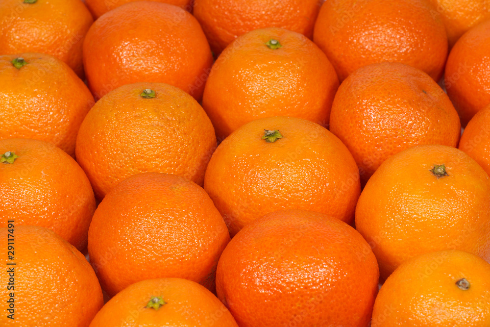 Many orange tangerines as background Many orange tangerines as background